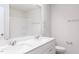 Bathroom with double vanity and a shower reflected in the large mirror above the counter at 172 Kobus Ct, Garner, NC 27529