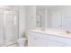 Clean bathroom featuring double sink vanity with modern fixtures and glass enclosed shower at 172 Kobus Ct, Garner, NC 27529