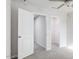 Bright bedroom features plush carpet, ceiling fan, and direct access to a spacious closet at 172 Kobus Ct, Garner, NC 27529
