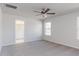 Large bedroom with ceiling fan, carpeted floor, natural light, and access to an ensuite bath at 172 Kobus Ct, Garner, NC 27529