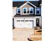 Exterior view of the home featuring a two-car garage and front door at 172 Kobus Ct, Garner, NC 27529