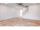 Spacious living area with a ceiling fan and hardwood flooring leading to the staircase at 172 Kobus Ct, Garner, NC 27529