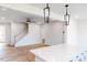 Bright living room featuring hardwood floors, white walls, and modern lighting fixtures at 172 Kobus Ct, Garner, NC 27529