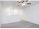 Upstairs space with carpeted floors featuring a ceiling fan, a white banister, and recessed lighting at 18 Twin Birch Dr, Angier, NC 27501