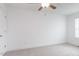 Spacious bedroom with a ceiling fan, plush carpet, and large window at 18 Twin Birch Dr, Angier, NC 27501