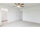Bright bedroom with carpet, a ceiling fan, and a view into the connected bathroom at 18 Twin Birch Dr, Angier, NC 27501