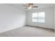 Bedroom with a ceiling fan, soft carpet, bright natural light, and white trim at 18 Twin Birch Dr, Angier, NC 27501