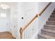 Open entryway with wood-look flooring, access to the stairway, and adjacent doors at 18 Twin Birch Dr, Angier, NC 27501