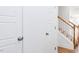 Bright entryway with coat closet and staircase featuring wood railing at 18 Twin Birch Dr, Angier, NC 27501