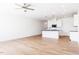 Spacious living area with light wood floors and a modern kitchen at 18 Twin Birch Dr, Angier, NC 27501