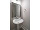 Bathroom featuring pedestal sink, framed mirror and light wall color at 1805 Bright Lantern Way, Wendell, NC 27591