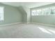 Spacious bedroom features large windows and soft carpet flooring at 1805 Bright Lantern Way, Wendell, NC 27591