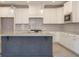 Bright kitchen features a large center island, white cabinets and stainless steel appliances at 1805 Bright Lantern Way, Wendell, NC 27591
