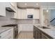 Bright kitchen featuring white cabinets, stainless appliances, and an island with sink at 1805 Bright Lantern Way, Wendell, NC 27591