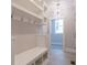 Mudroom featuring built-in bench, storage shelves, hooks and access to the home at 1805 Bright Lantern Way, Wendell, NC 27591