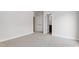 Spacious bedroom with neutral carpet, double closets, and a doorway leading to an adjoining bathroom at 1917 Fishamble St, Fuquay Varina, NC 27526