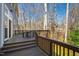 Wooden back deck features space for outdoor seating overlooking the yard at 201 Adams Way, Chapel Hill, NC 27516