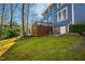 Expansive backyard with lush greenery and a raised deck area at 201 Adams Way, Chapel Hill, NC 27516