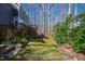 Landscaped backyard with a multi-level deck and lush plantings at 201 Adams Way, Chapel Hill, NC 27516