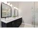 Bathroom with a double vanity, two large mirrors, and a separate shower with glass doors at 201 Adams Way, Chapel Hill, NC 27516