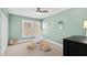 Bedroom with a soft green walls, carpeted floors, a teepee, and natural lighting at 201 Adams Way, Chapel Hill, NC 27516