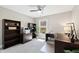 Well-lit office features built-in shelving and a ceiling fan at 201 Adams Way, Chapel Hill, NC 27516