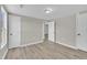A neutral tone bedroom features wood-look flooring and white doors at 2080 Saint Paul Church Rd, Roxboro, NC 27574