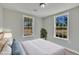 Serene bedroom with dual windows providing natural light and a relaxing ambiance at 2080 Saint Paul Church Rd, Roxboro, NC 27574