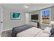 Relaxing bedroom features a modern television, dresser, and neutral tones for a peaceful retreat at 2080 Saint Paul Church Rd, Roxboro, NC 27574