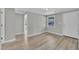 Bedroom showcasing light gray walls, light wood flooring, and an outside view from the window at 2080 Saint Paul Church Rd, Roxboro, NC 27574