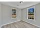 The bedroom boasts natural light with wood-look flooring and neutral colors at 2080 Saint Paul Church Rd, Roxboro, NC 27574