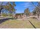 Exterior showcasing a home with a wooden porch and steps, nestled in a yard with natural landscaping at 2080 Saint Paul Church Rd, Roxboro, NC 27574