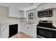 Updated kitchen with stainless appliances, modern cabinets, and ample counter space at 2080 Saint Paul Church Rd, Roxboro, NC 27574