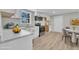 Bright kitchen boasts stainless steel appliances, white cabinets, and an eat-in dining area at 2080 Saint Paul Church Rd, Roxboro, NC 27574