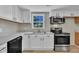 Updated kitchen with stainless appliances, modern cabinets, and ample counter space at 2080 Saint Paul Church Rd, Roxboro, NC 27574