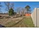 View of a large backyard with a shed and plenty of open space surrounded by bare trees at 2120 Cokey Rd, Rocky Mount, NC 27801