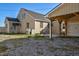 Backyard with a brick house and a detached covered patio with grill at 2120 Cokey Rd, Rocky Mount, NC 27801