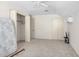 Bedroom featuring white walls, neutral carpet, a ceiling fan, and closet space, providing ample storage options at 2120 Cokey Rd, Rocky Mount, NC 27801