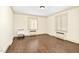 Bedroom features hardwood floors, white walls, crown molding, and bright natural light at 2120 Cokey Rd, Rocky Mount, NC 27801