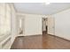 Bedroom features hardwood floors, white walls, crown molding, and bright natural light at 2120 Cokey Rd, Rocky Mount, NC 27801
