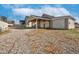 Gravel driveway leading to a home with a carport and garage at 2120 Cokey Rd, Rocky Mount, NC 27801