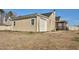 Tan home with a screened porch and a detached garage near grass yard at 2120 Cokey Rd, Rocky Mount, NC 27801