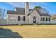 Charming home featuring a chimney, gray roof, and well-kept lawn, blending classic and modern appeal at 2120 Cokey Rd, Rocky Mount, NC 27801
