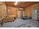 Garage space with wood paneled walls featuring weight lifting equipment at 2120 Cokey Rd, Rocky Mount, NC 27801