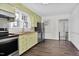 Bright kitchen features stainless appliances, light green cabinets, and wood countertops at 2120 Cokey Rd, Rocky Mount, NC 27801