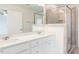 Bright bathroom with a double vanity, quartz countertops and frameless glass shower at 22 Twin Birch Dr, Angier, NC 27501