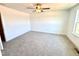 A bright, spacious bedroom features neutral carpet, white walls, and a modern ceiling fan at 22 Twin Birch Dr, Angier, NC 27501