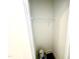 Small, unfinished storage closet featuring a wire shelf and dark flooring at 22 Twin Birch Dr, Angier, NC 27501