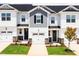 New townhomes with light siding, well maintained lawn and landscaping at 22 Twin Birch Dr, Angier, NC 27501