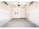Empty single-car garage with concrete flooring and drywall at 22 Twin Birch Dr, Angier, NC 27501